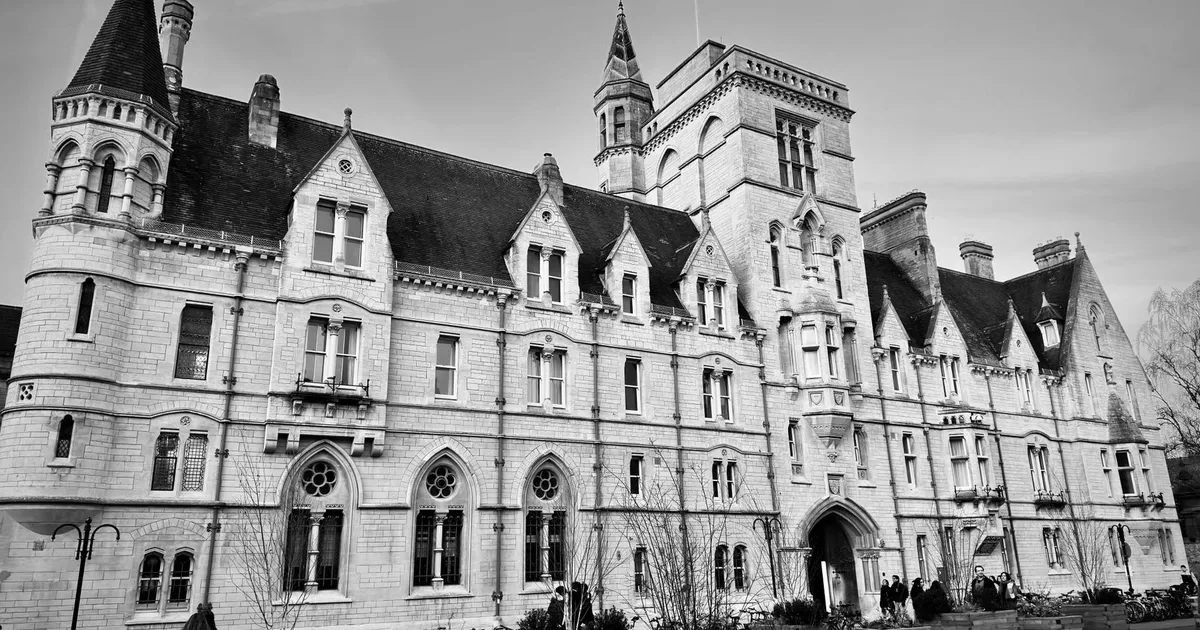 A Victorian-style university building in Oxford, displaying classic English architecture.
