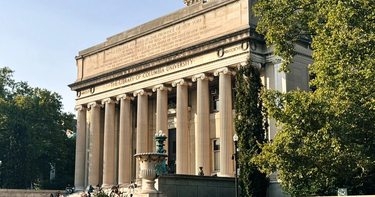 Historic Columbia University Library in a sunny outdoor setting.