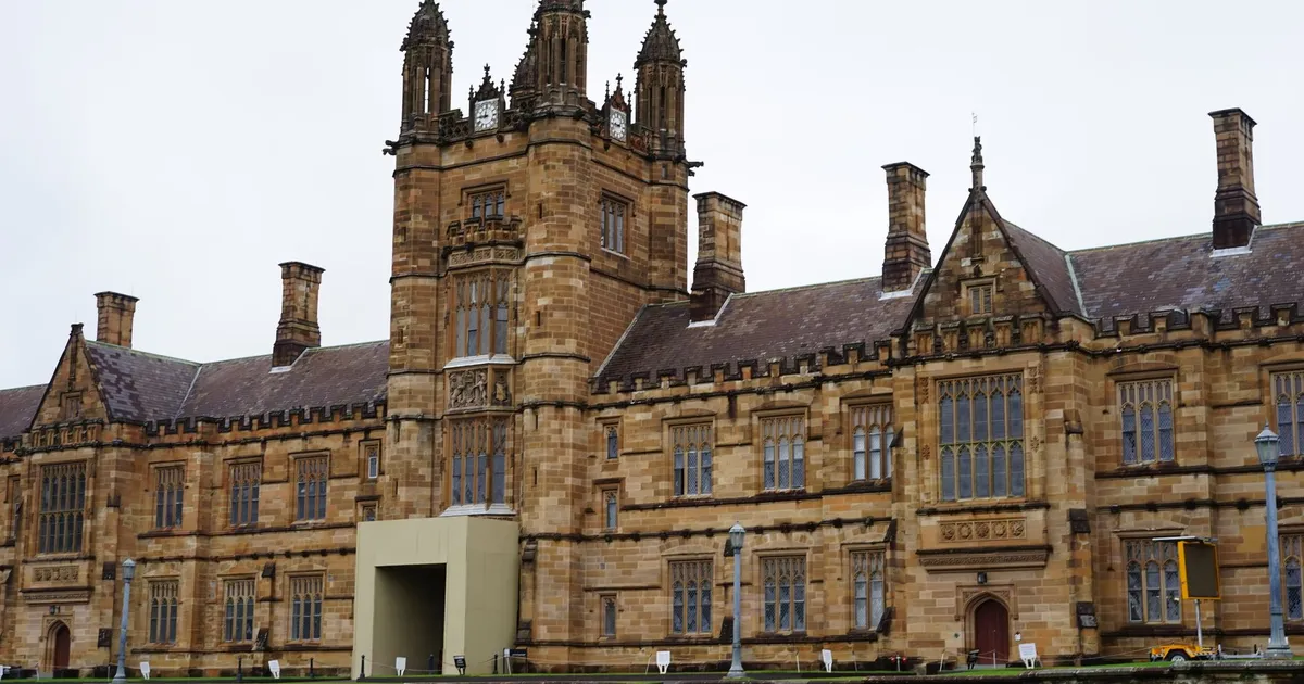 Front view of a historic university building with gothic architecture.