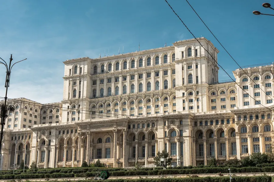 Capture of the iconic Palace of the Parliament in Bucharest, Romania under clear skies.